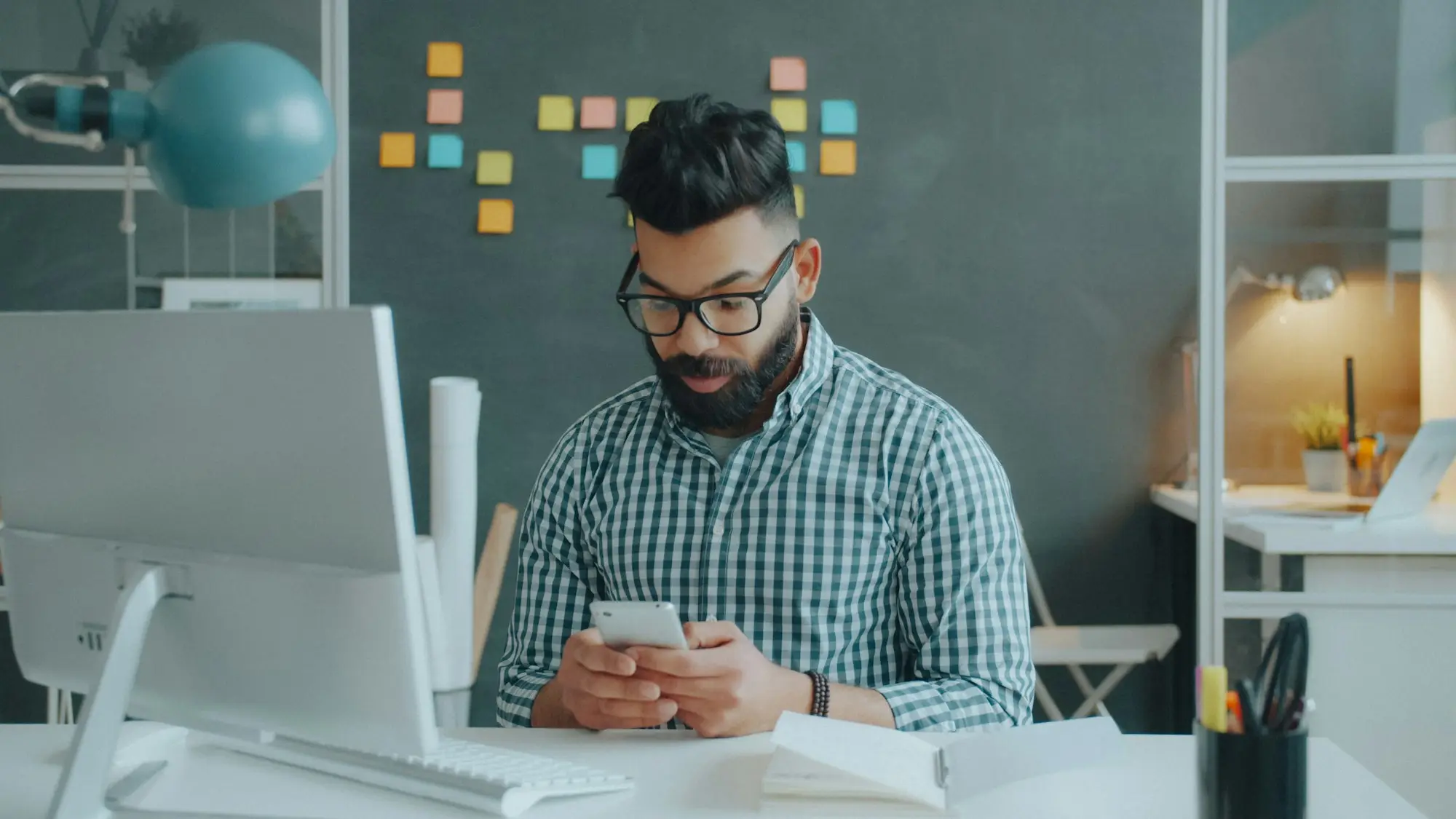 Close shot of a person reading a consent screen on a smartphone in an office